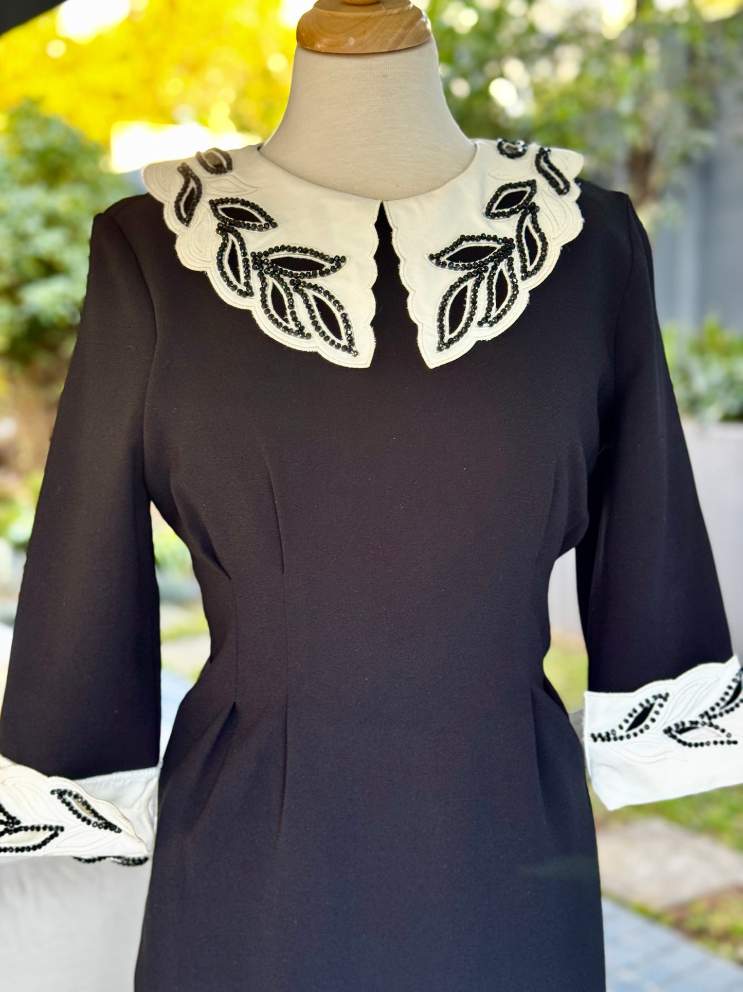 Vintage-Inspired Black Midi Dress with Embroidered Collar and Cuffs